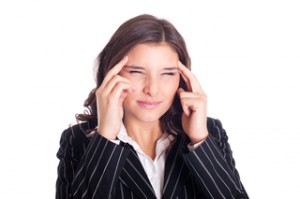 Geschäftsfrau hat Kopfschmerzen Burn Out oder Depressionen werden oft durch Stress hervorgerufen